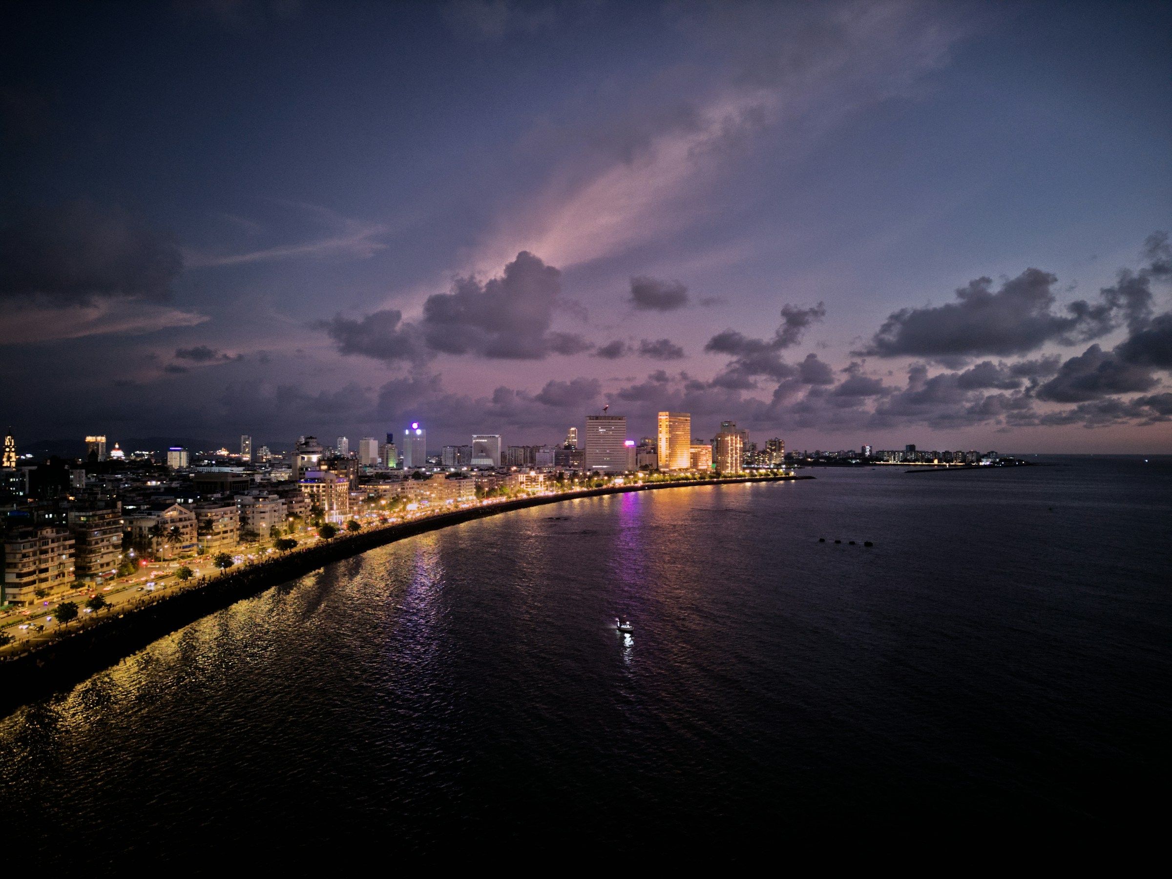 The curve of Marine Drive in Mumbai lit up at dusk